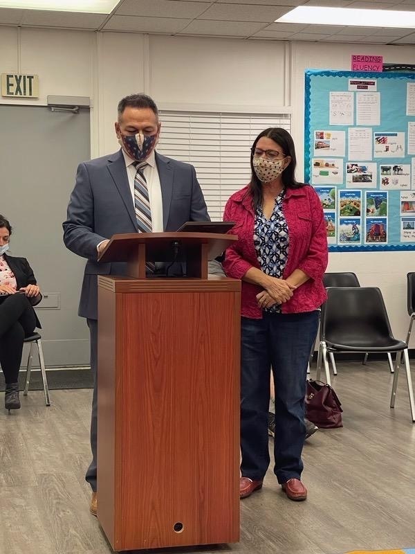 Mr. Verduzco presenting Kathy with a plaque of appreciation